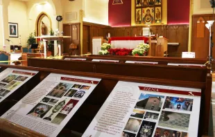Posters describing Eucharistic miracles are displayed in pews at St. Edmund’s Church. Agnieszka Ruck. Courtesy of the BC Catholic.